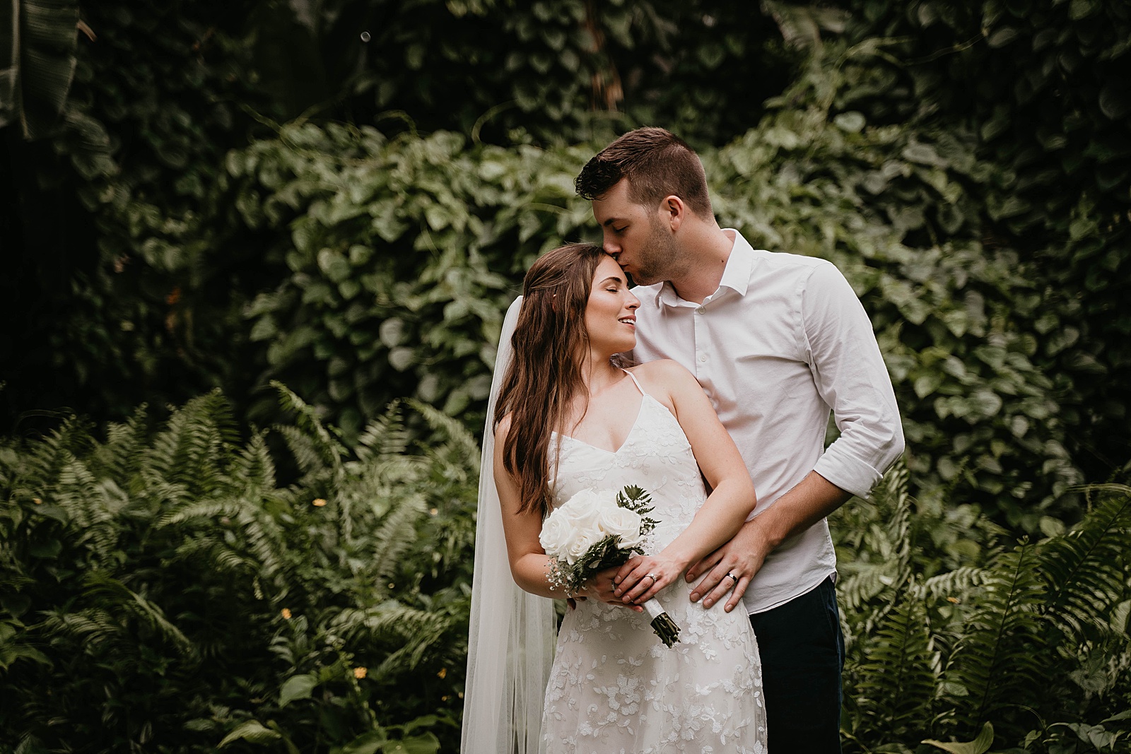 Intimate Fort Lauderdale Elopement Bride and Groom Portrait in front of greenery captured by South Florida Elopement Photographer, Krystal Capone Photography