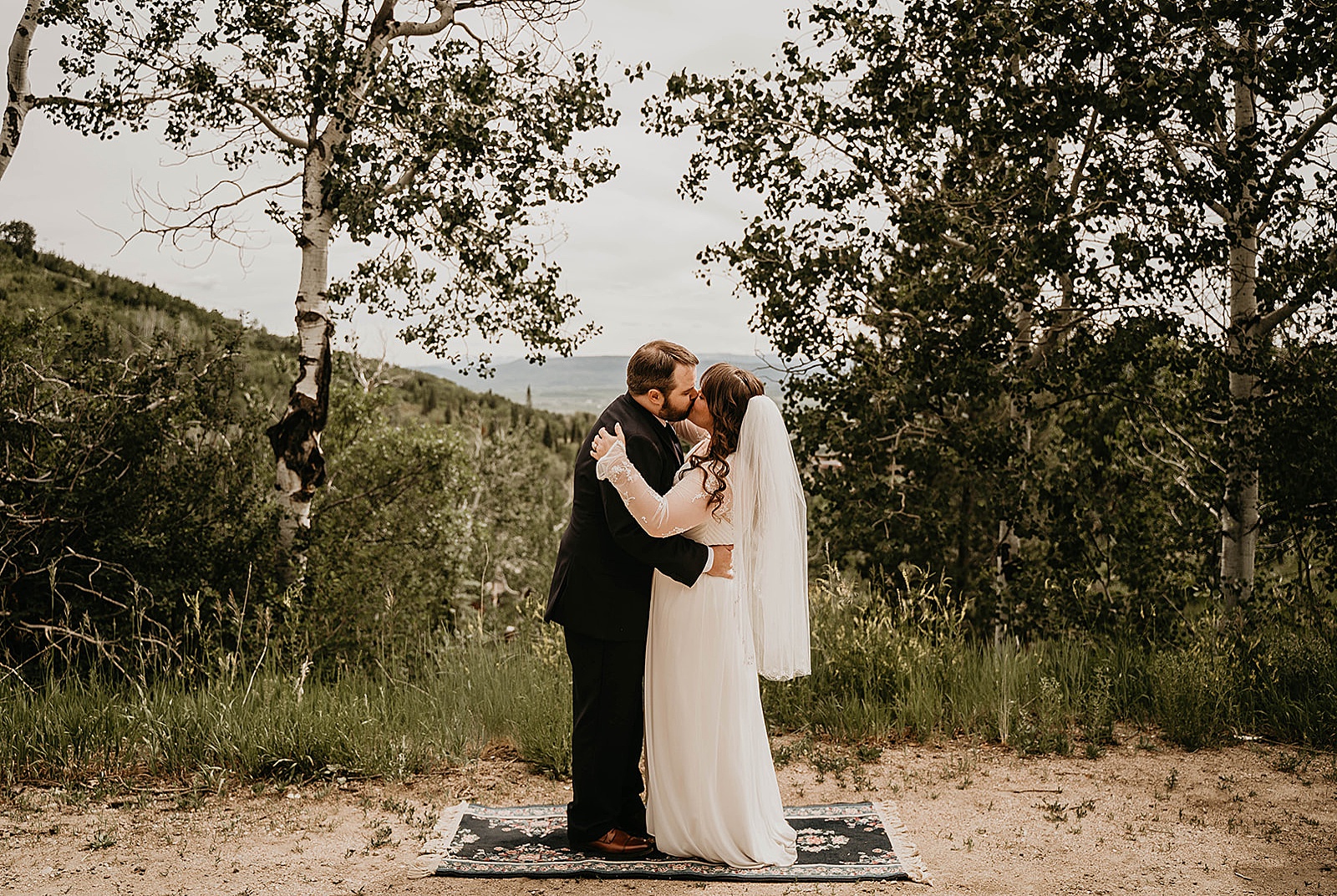 Rustic Colorado Elopement Ceremony First Kiss by Krystal Capone Photography