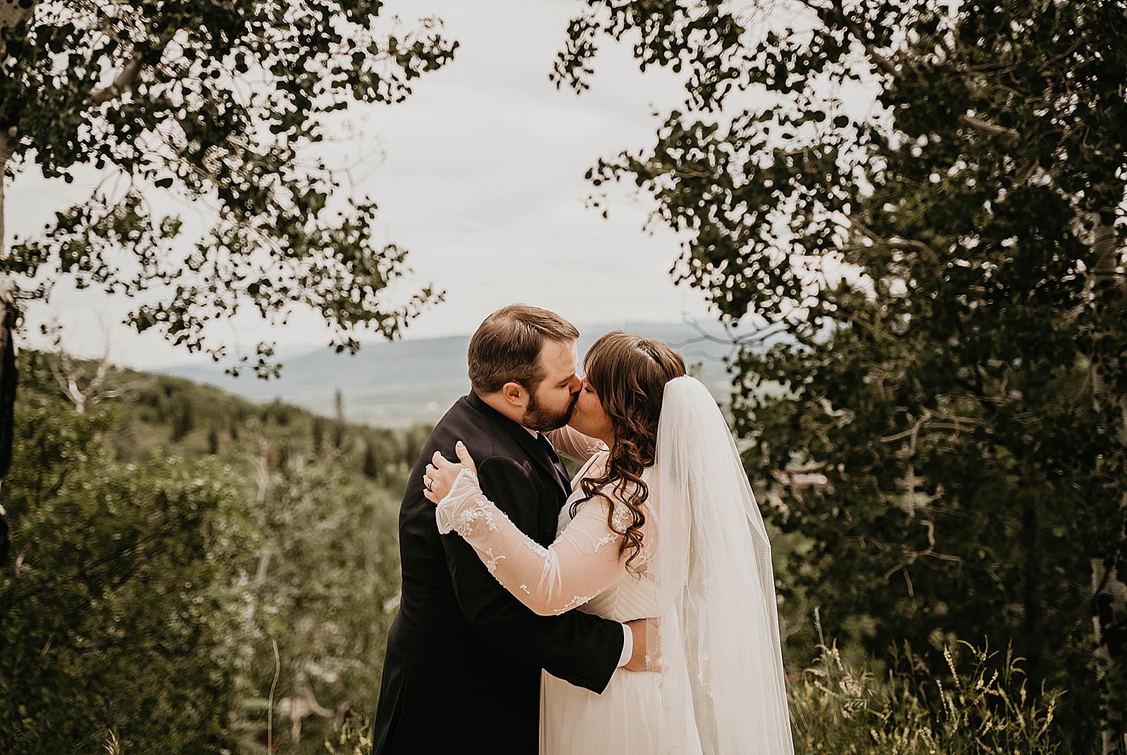 Rustic Colorado Elopement Ceremony First Kiss by Krystal Capone Photography