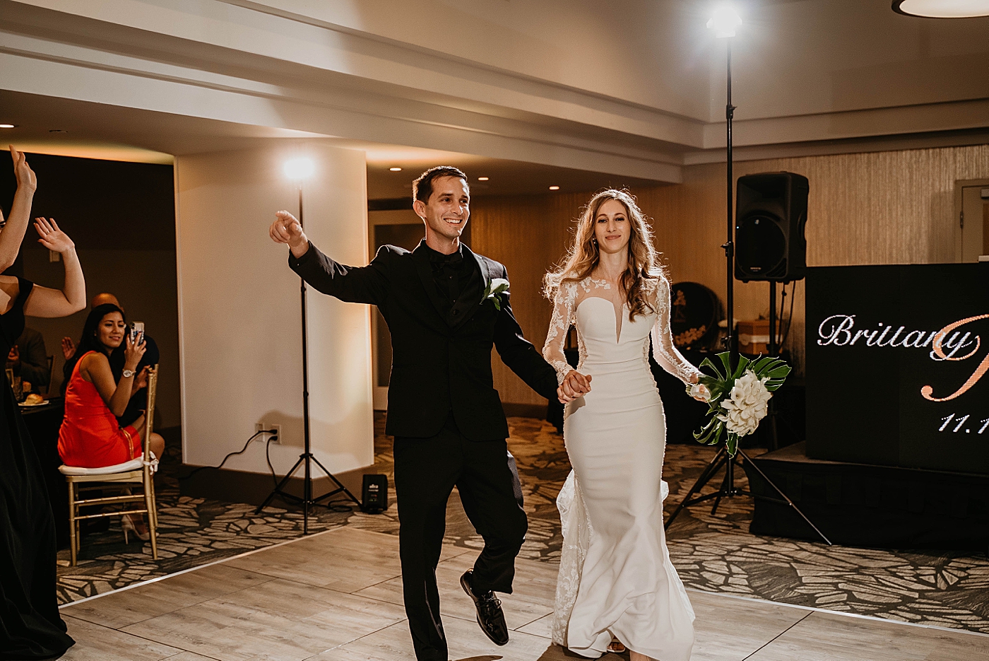 Bride and Groom entering the Receotion Waterstone Resort and Marina Wedding captured by South Florida Wedding Photographer Krystal Capone Photography