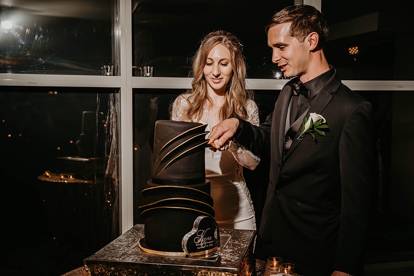 Bride and Groom cutting cake Waterstone Resort and Marina Wedding captured by South Florida Wedding Photographer Krystal Capone Photography
