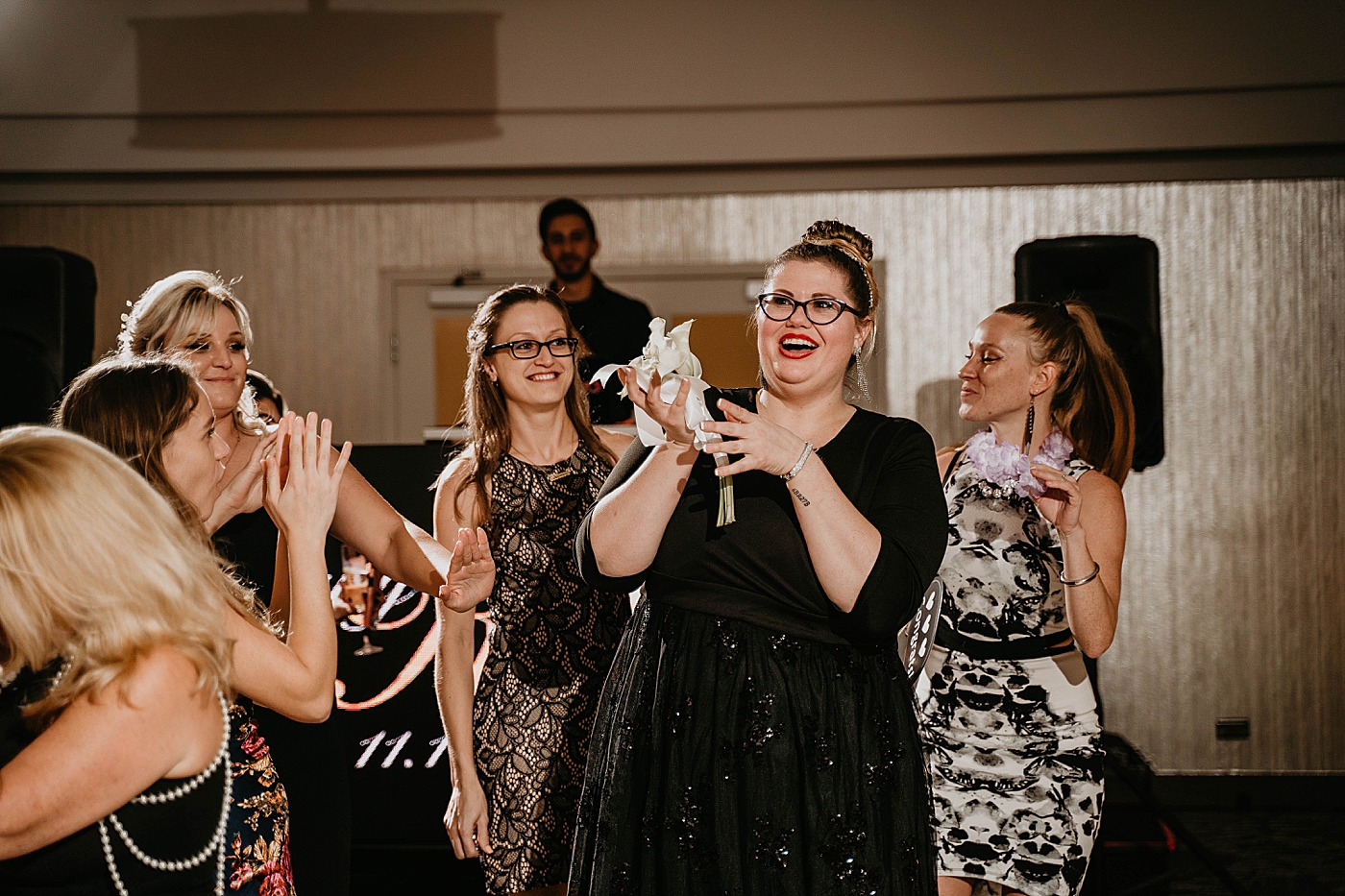 Bouquet catch at Reception single ladies Waterstone Resort and Marina Wedding captured by South Florida Wedding Photographer Krystal Capone Photography