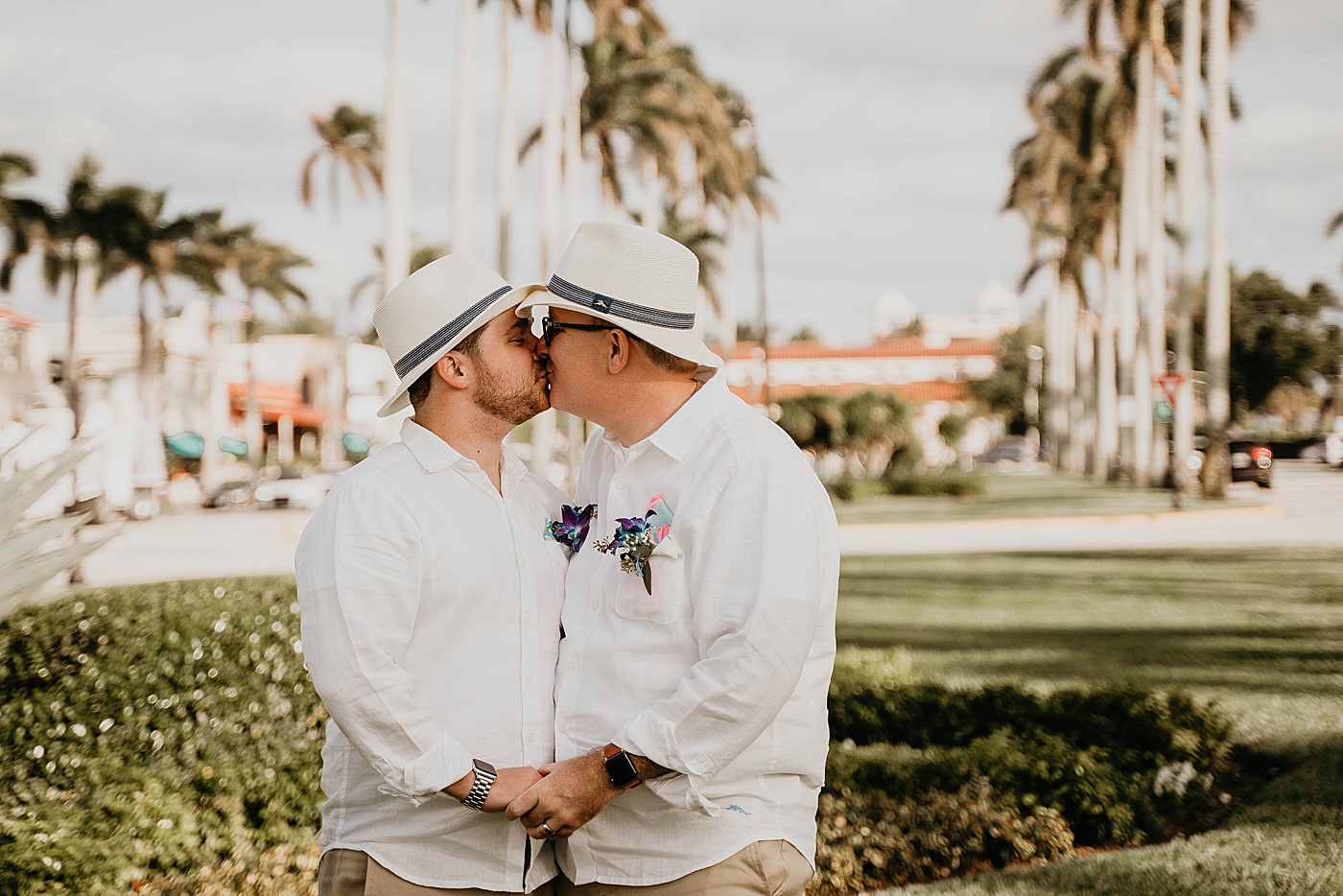Couple kissing with fedoras on Palm Beach Elopement Photography captured by South Florida Photographer Krystal Capone Photography 