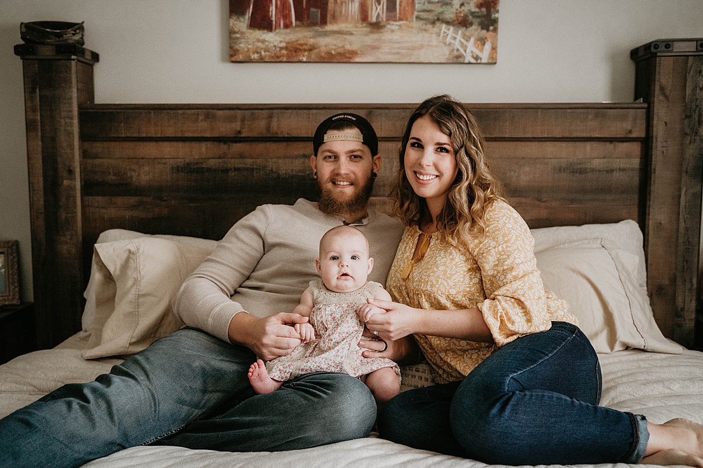 New Mother and Father laying in bed with new born baby At Home South Florida Family Photography captured by South Florida Family Photographer Krystal Capone Photography 