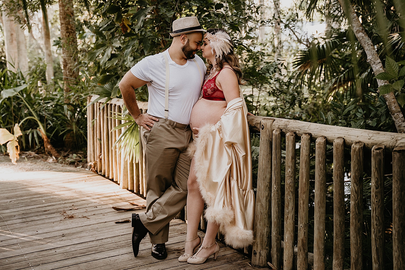 Husband nuzzling wife on bridge vintage inspired outfits South Florida Maternity Photography captured by South Florida Family Photographer Krystal Capone Photography 