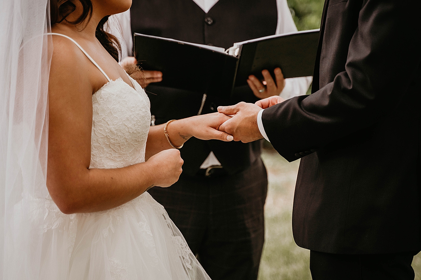 Groom putting wedding band on bride Intimate South Florida Wedding Photography captured by Wedding Photographer Krystal Capone Photography