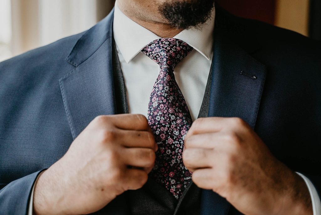 Closeup of Groom's floral tie 94th Aero Squadron Miami Wedding Photography captured by South Florida Engagement Photographer Krystal Capone Photography 