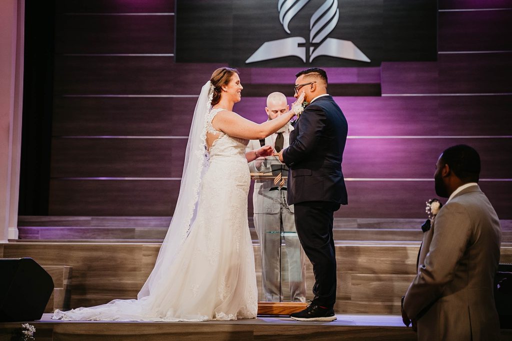 Bride comforting Groom during Ceremony 94th Aero Squadron Miami Wedding Photography captured by South Florida Engagement Photographer Krystal Capone Photography 