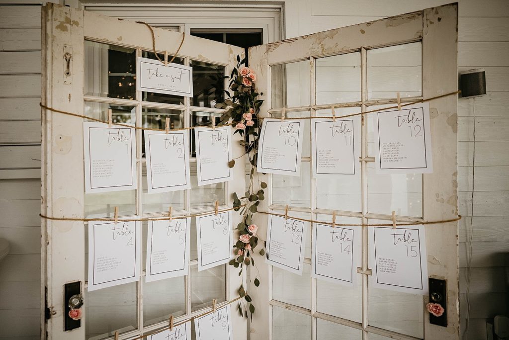 Reception detail shot of table numbers and assignments Ever After Farms Wedding Photography captured by South Florida Wedding Photographer Krystal Capone Photography 