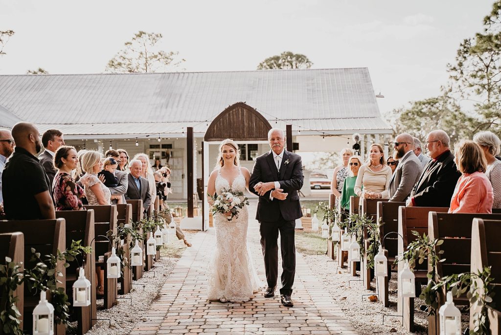 Bride and Father walking down aisle Ever After Farms Wedding Photography captured by South Florida Wedding Photographer Krystal Capone Photography 