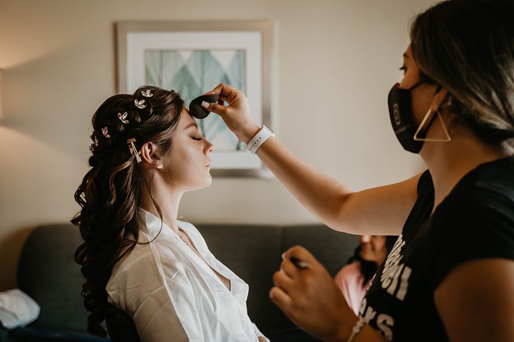 Bride getting ready getting makeup done by makeup artist Hawks Cay Resort Wedding Photography captured by South Florida Wedding Photographer Krystal Capone Photography 