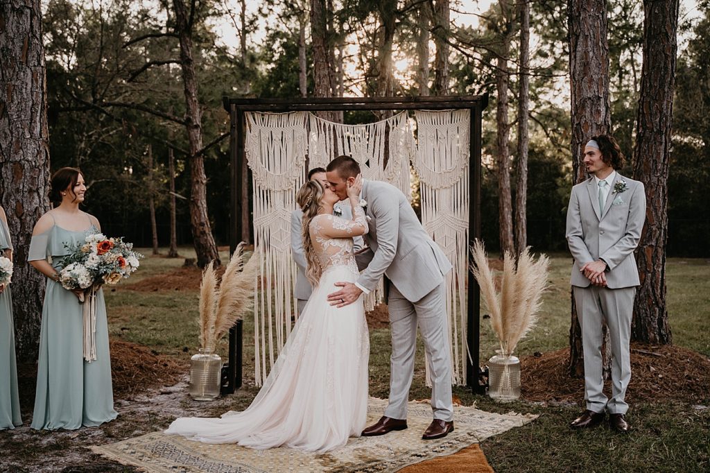 Just married Bride and Groom kissing at the alter Intimate South Florida Wedding Photography captured by South Florida Wedding Photographer Krystal Capone Photography