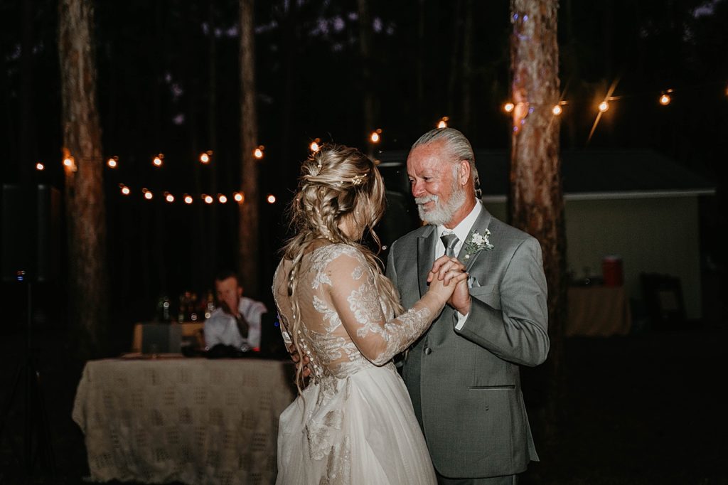 Father daughter dance at night in the forest Intimate South Florida Wedding Photography captured by South Florida Wedding Photographer Krystal Capone Photography