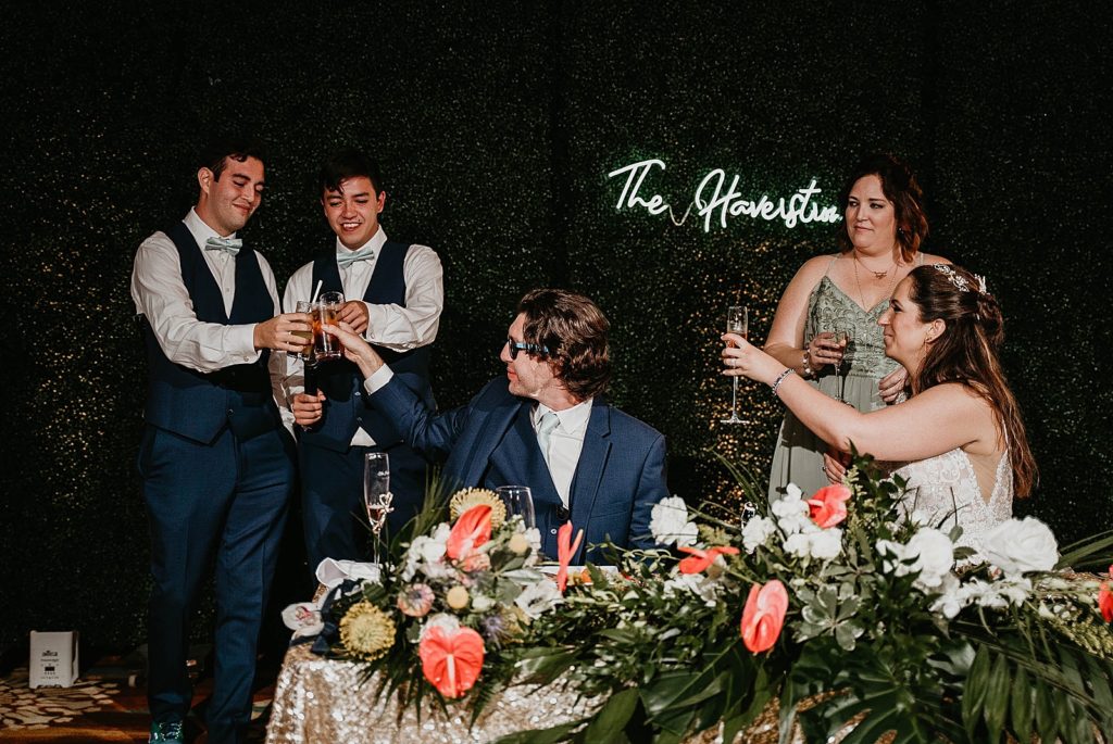 Bride and Groom toasting after speech Jupiter Beach Resort Wedding Photography captured by South Florida Wedding Photographer Krystal Capone Photography 