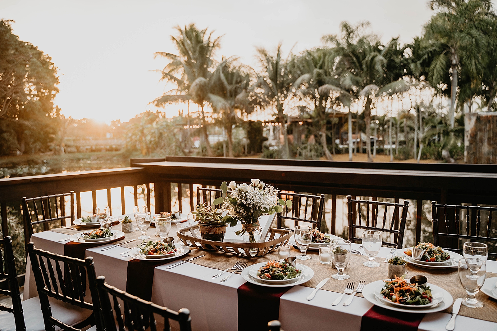Reception table detail shot with salad appetizer plates by the calm water Living Sculptures Sanctuary Wedding Photography captured by South Florida Wedding Photographer Krystal Capone Photography
