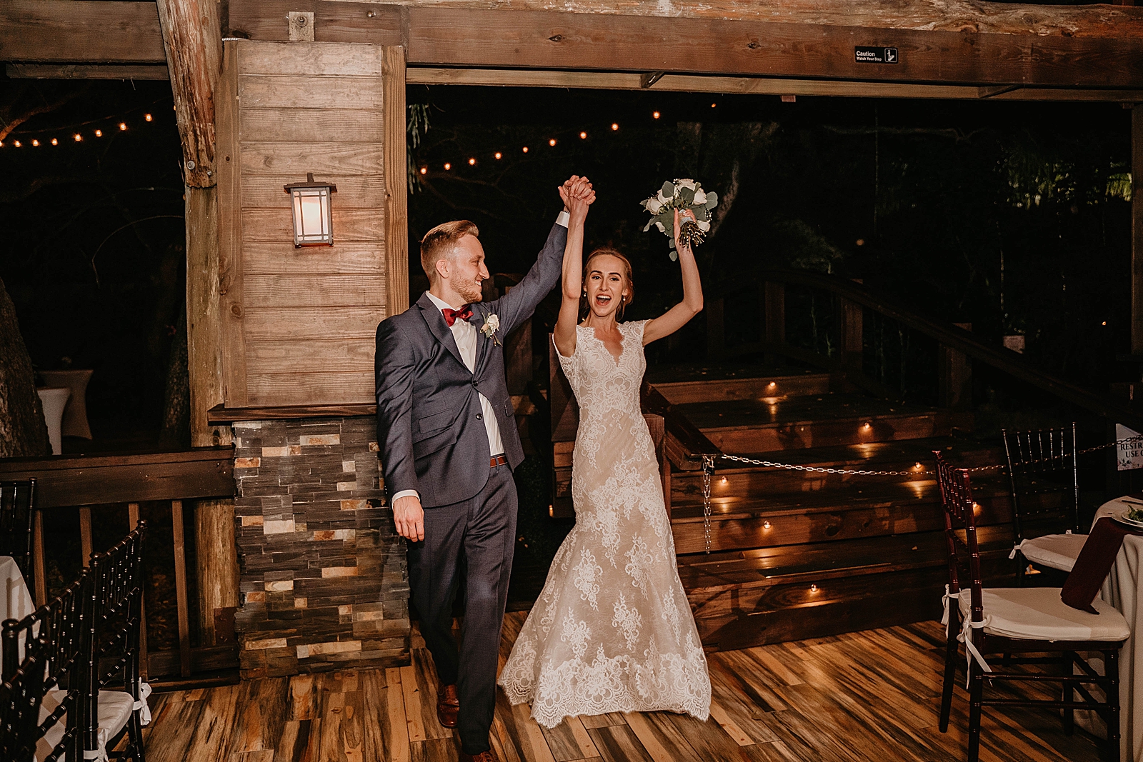 Bride and Groom entering Reception holding hands and having fun Living Sculptures Sanctuary Wedding Photography captured by South Florida Wedding Photographer Krystal Capone Photography