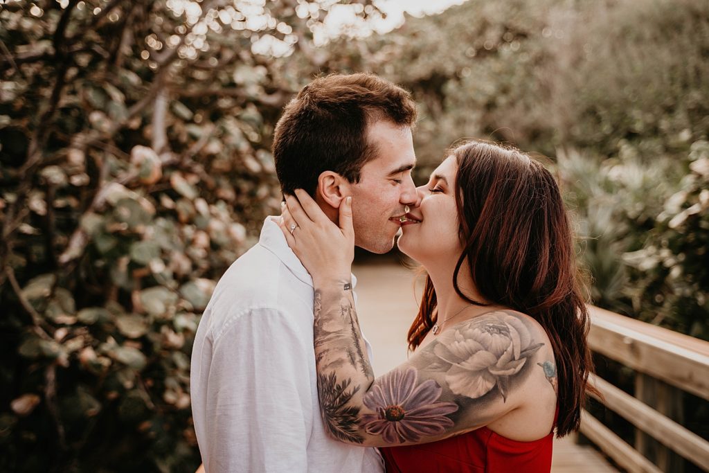 Closeup of couple about to kiss on the bridge Palm Beach Engagement Photography captured by South Florida Engagement Photographer Krystal Capone Photography 