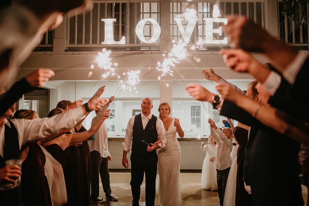Bride and Groom starting sparkler exit The Lake House Fort Pierce Wedding Photography captured by South Florida Wedding Photographer Krystal Capone Photography 