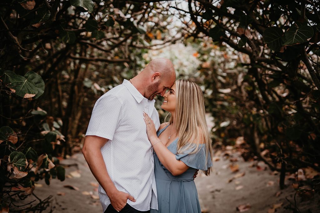 Couple resting their heads on each other
