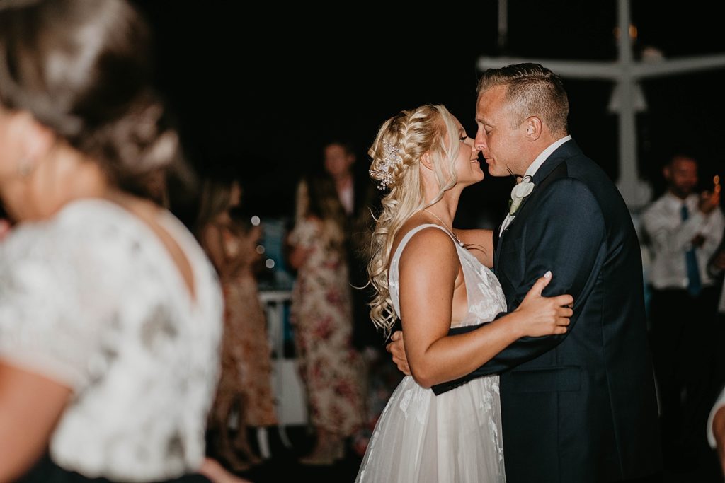 Bride and Groom about to kiss while dancing