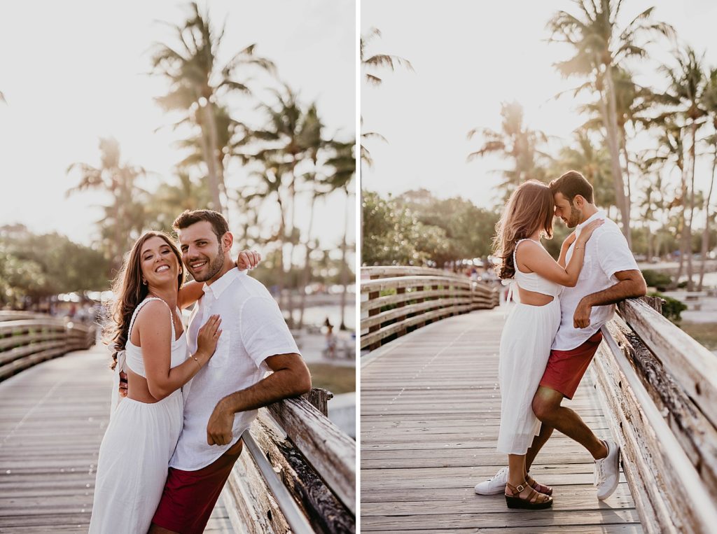 Couple holding each other close on the bridge