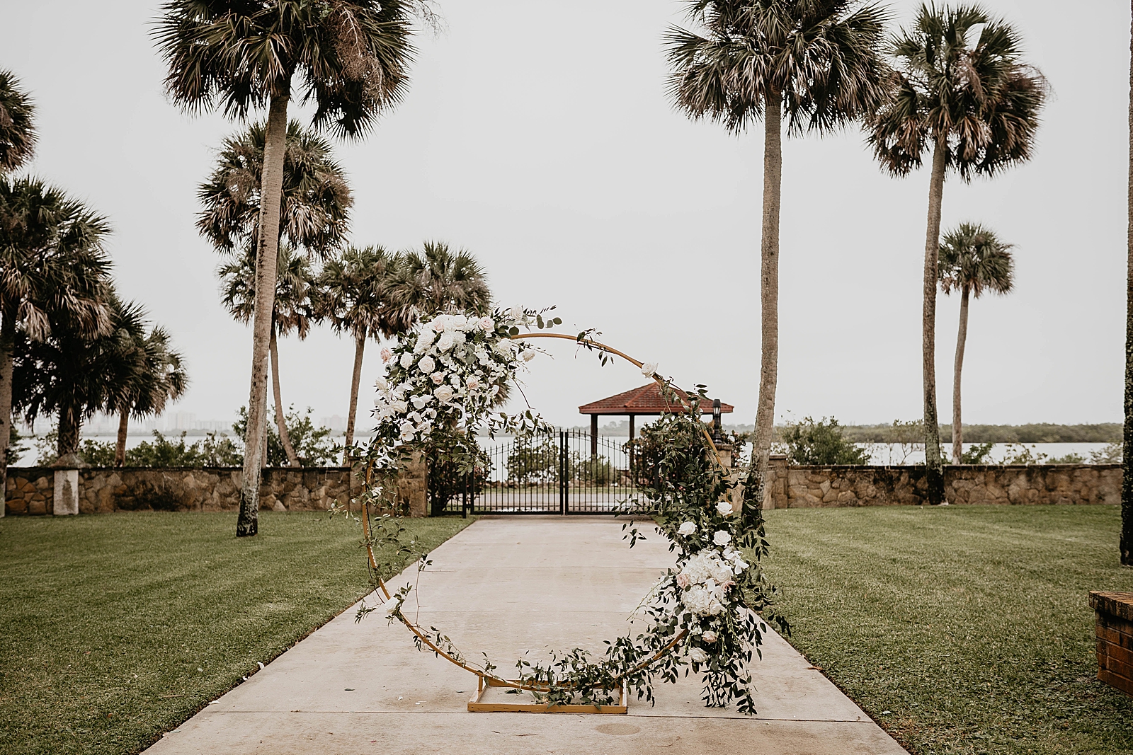 Detail shot of Ceremony Circular arch with floral decor