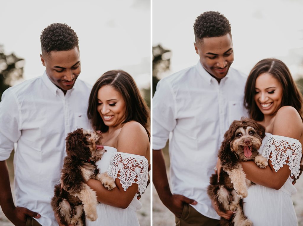 Couple looking at their dog yawn