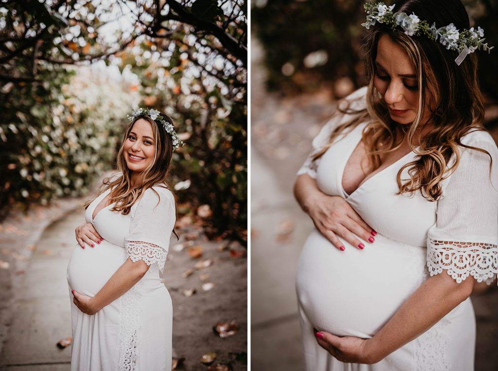 Woman holding her pregnant stomach and looking at it