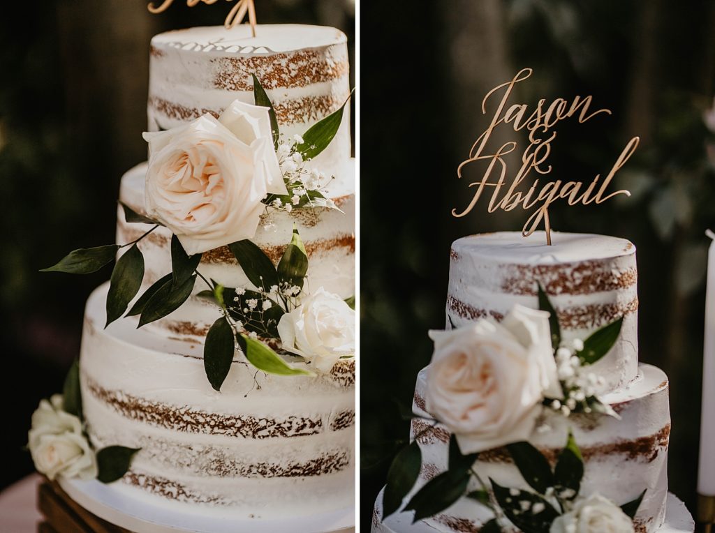 Wedding cake detail shot with cursive cake topper