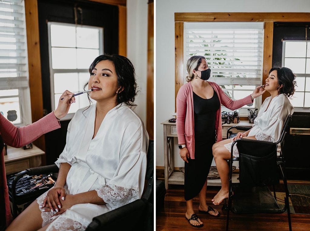 Makeup artist doing makeup for Bride