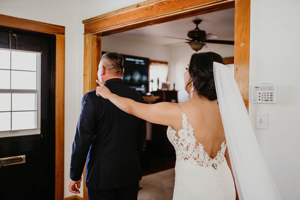 First Look Bride tapping Father on shoulder