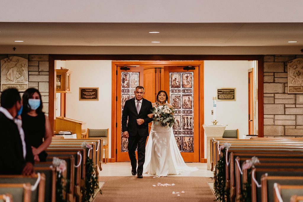 Bride coming down the aisle with Father for Ceremony