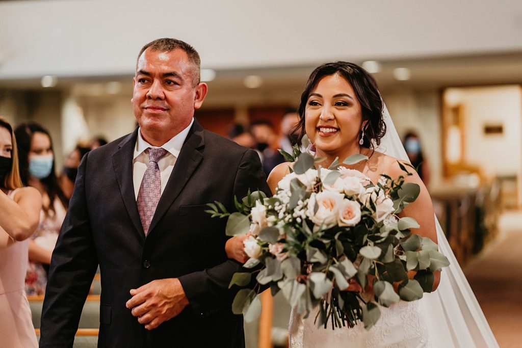 Father and Bride arm in arm for Ceremony