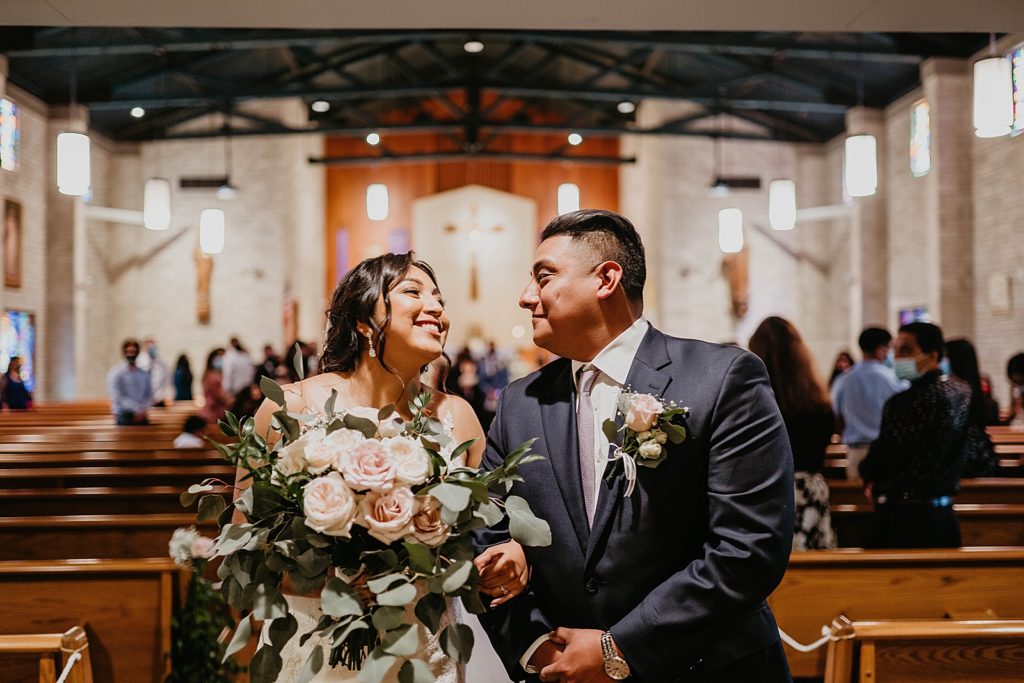 Bride and Groom arm in arm exiting Ceremony