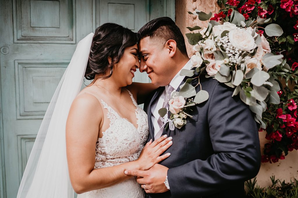 Bride and Groom resting their heads on each other
