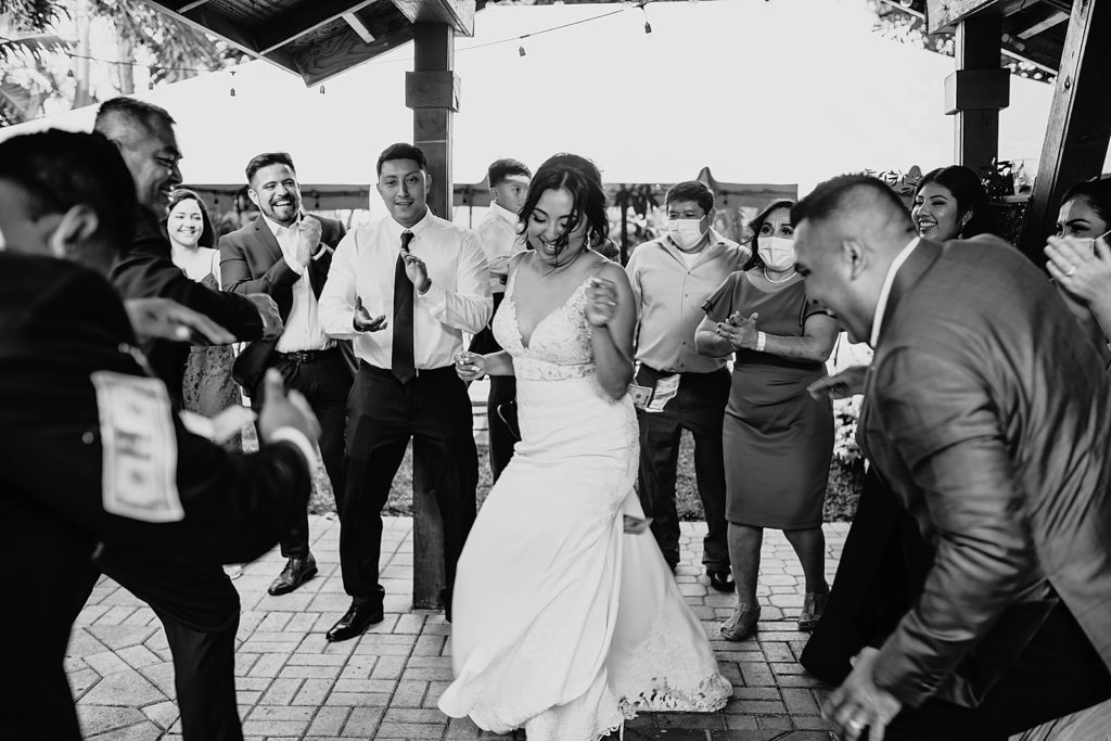 B&W Bride in the middle of dancing circle