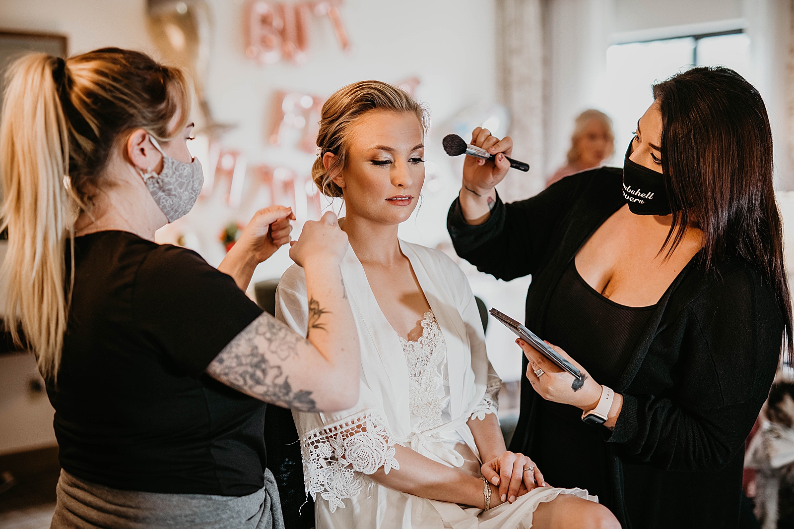 Bride getting ready getting makeup done