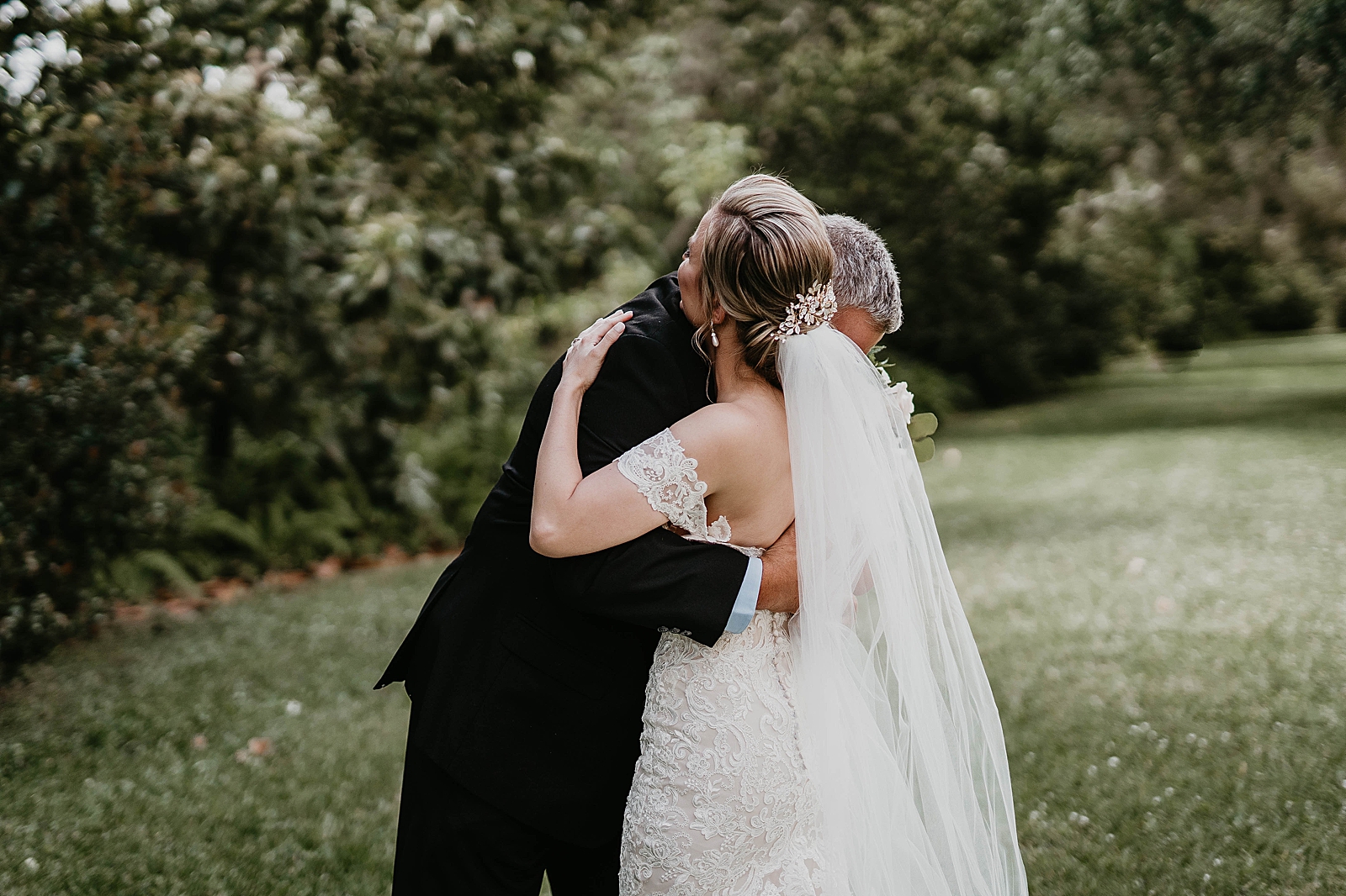 Bride and Father hugging after first look