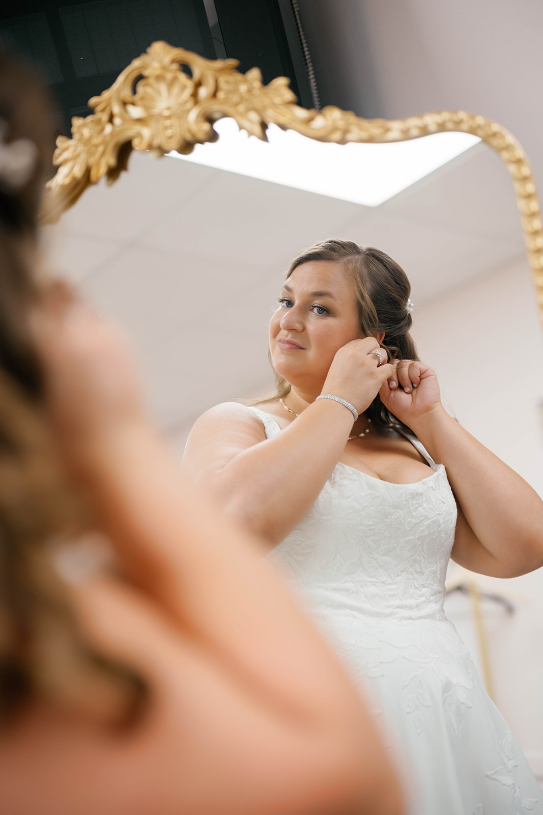 Shannon putting on earrings