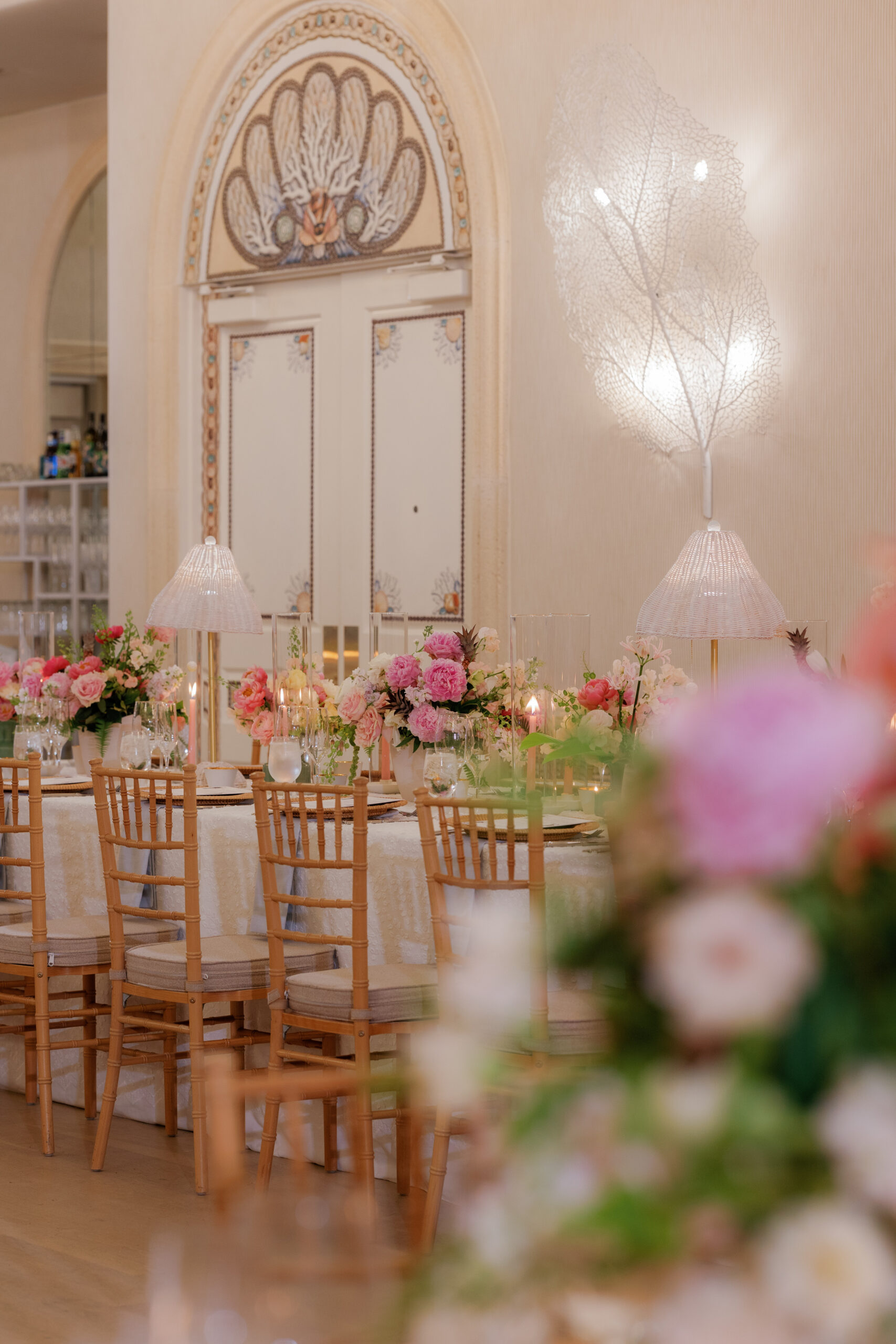 Harper and Luke wedding at The Colony Palm Beach - reception - An elegantly set dinner table with pink and white floral arrangements and candle