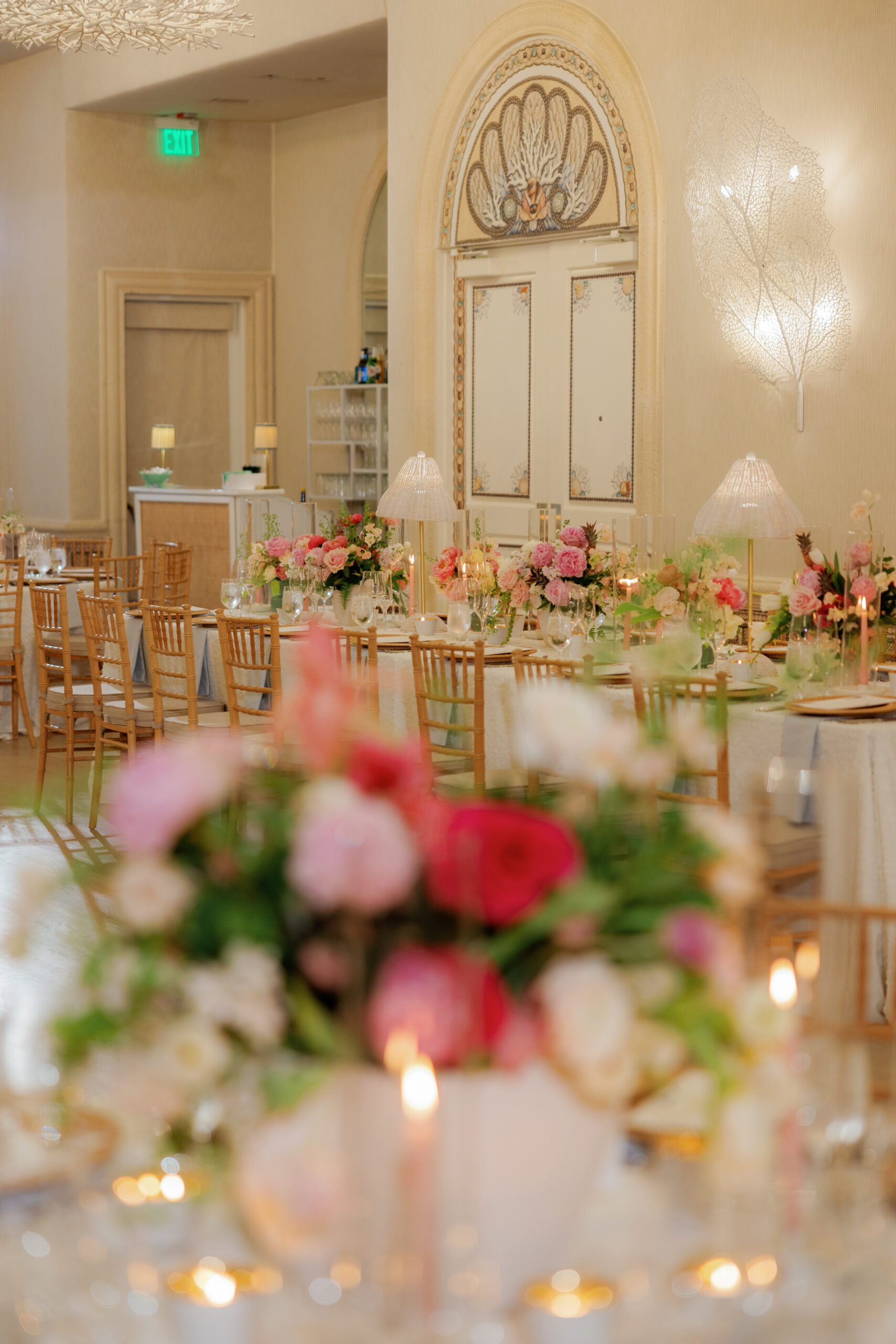 Harper and Luke wedding at The Colony Palm Beach - reception - A beautifully decorated reception hall with tables set with floral arrangements 