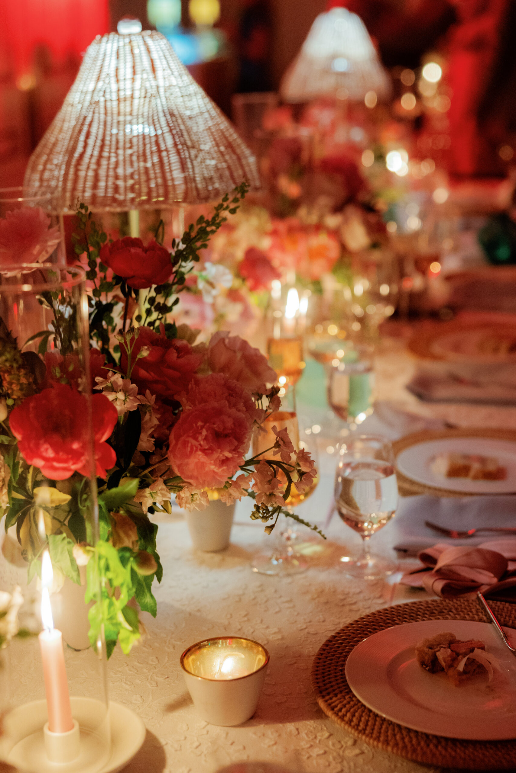 Harper and Luke wedding at The Colony Palm Beach - reception - A beautifully decorated dinner table with floral arrangements, candles, and plac