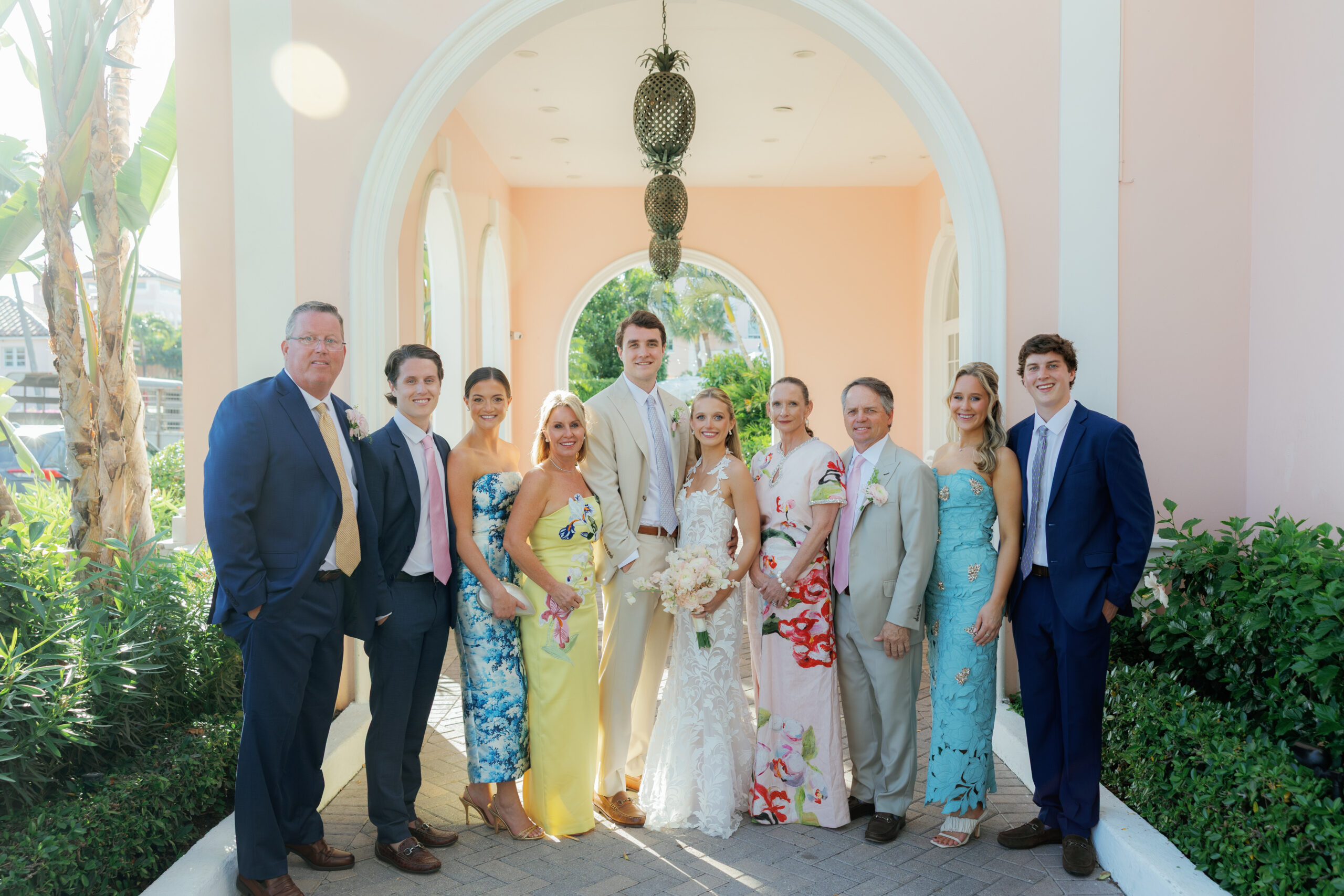 Harper and Luke wedding at The Colony Palm Beach - getting ready - A formal group portrait of the bride, groom, and their family or wedding party u