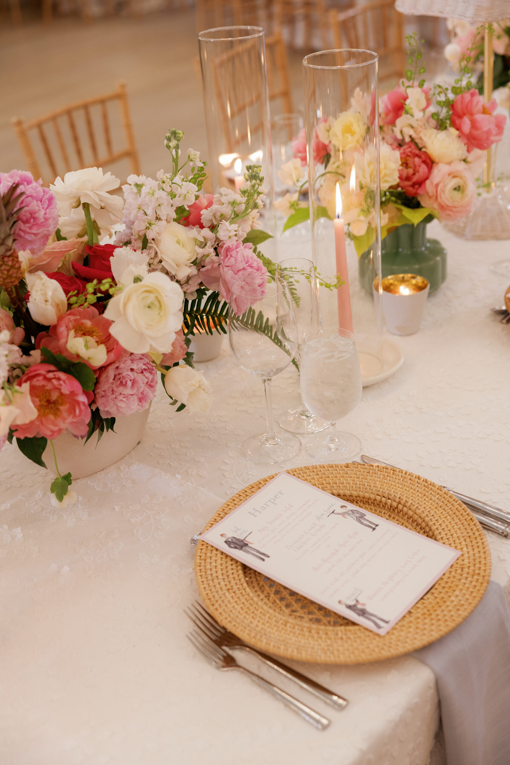 Harper and Luke wedding at The Colony Palm Beach - reception - A beautifully decorated reception table with floral arrangements, candles, glass