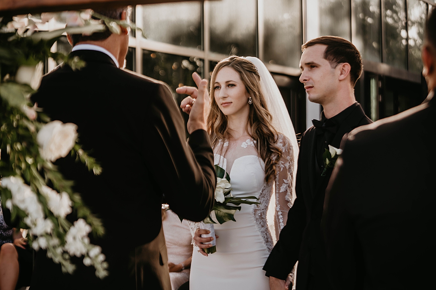Bride and groom at the alter for Homily Waterstone Resort and Marina Wedding captured by South Florida Wedding Photographer Krystal Capone Photography