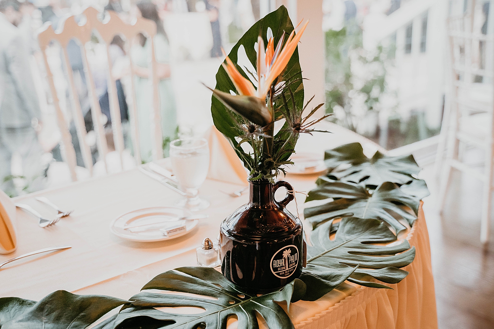 Wedding detail shot of Pakm leaf centerpiece Jupiter Lighthouse Wedding Photography captured by South Florida Wedding Photographer Krystal Capone Photography