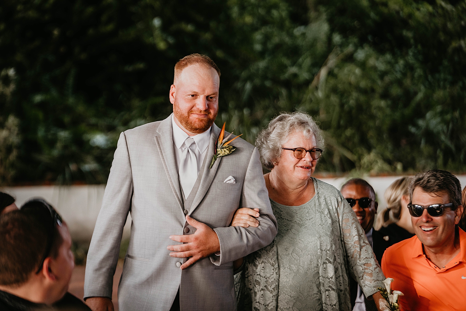Groom walking down the aisle with mother Jupiter Lighthouse Wedding Photography captured by South Florida Wedding Photographer Krystal Capone Photography