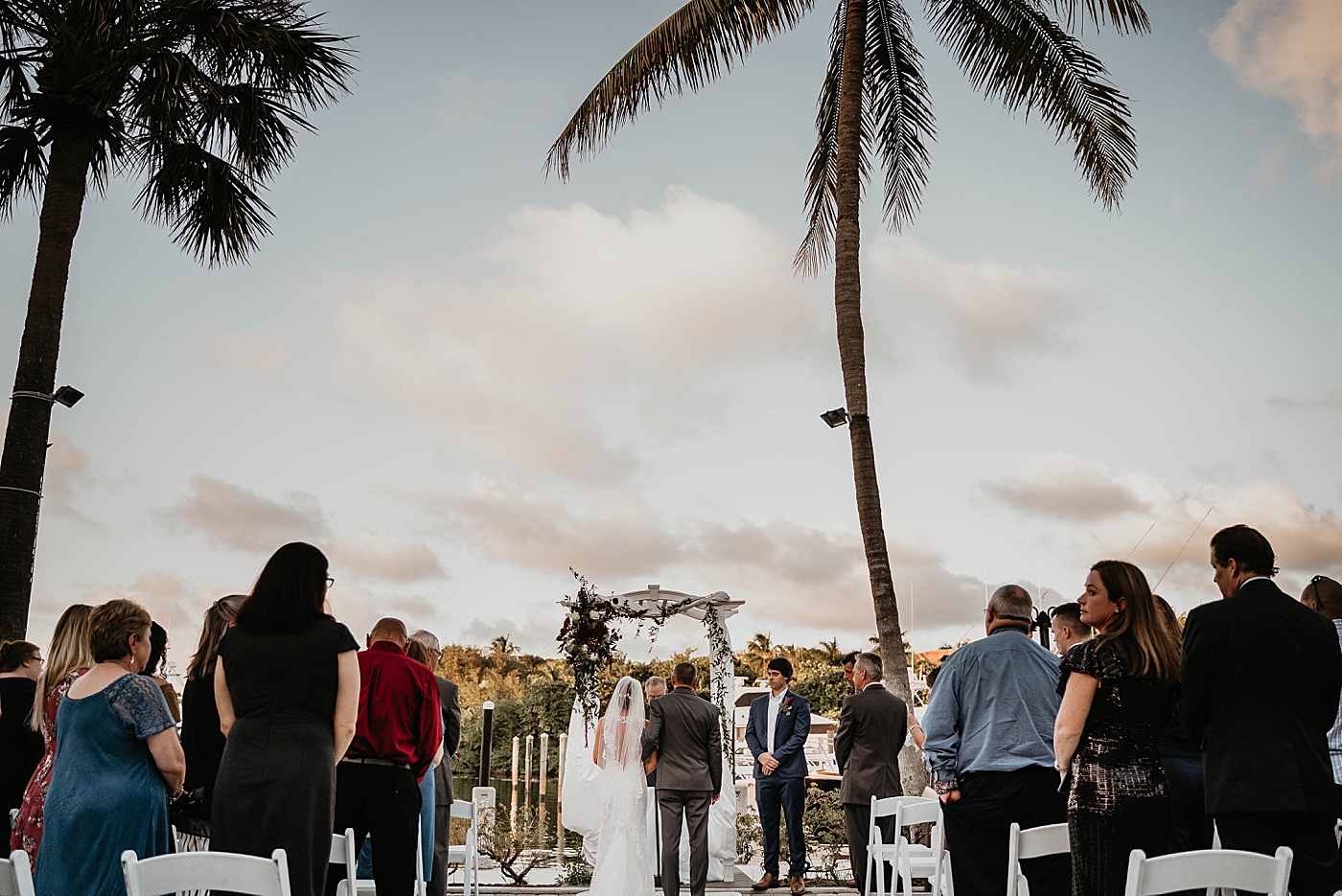 father and Bride at alter Ceremony audience standing Out of the Blue Celebrations Wedding Photography captured by South Florida Wedding Photographer Krystal Capone Photography 