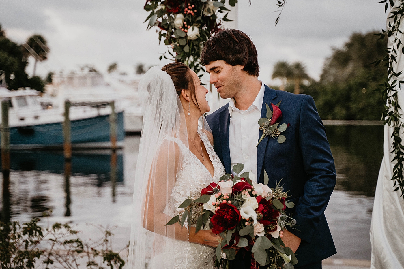Bride and Groom looking at each other by the water portrait Out of the Blue Celebrations Wedding Photography captured by South Florida Wedding Photographer Krystal Capone Photography 