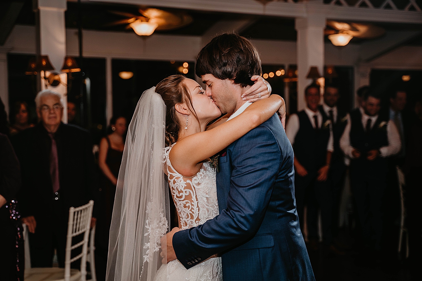 Bride and Groom kissing during first dance Out of the Blue Celebrations Wedding Photography captured by South Florida Wedding Photographer Krystal Capone Photography 